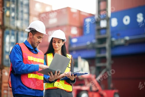 Preview: Professionals discussing logistics at a shipping container yard during daylight hours