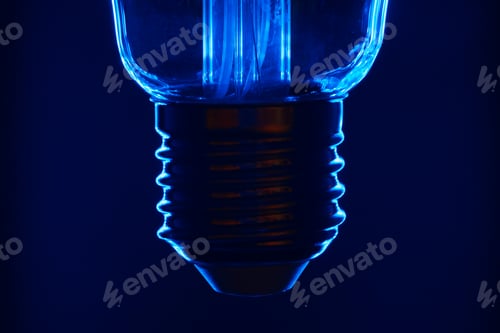 Preview: Light bulb on black background close up
