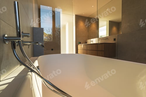 Preview: Designer bathtub in a white and wooden bathroom of a luxury apartment