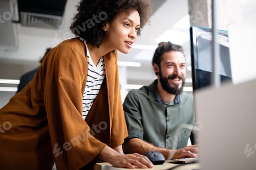 Preview: Happy young business people colleagues talking working in office