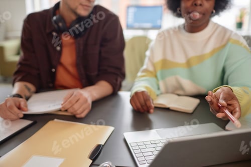 Preview: Close Up of Two People in Business Meeting Pointing at Screen
