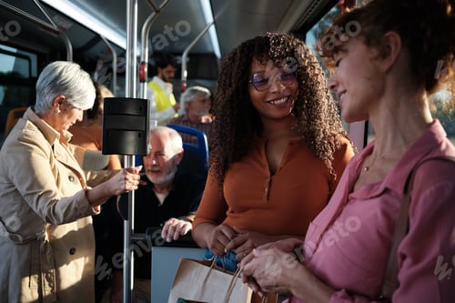 Preview: Friends talking and smiling inside public bus