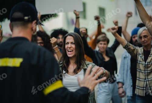 Preview: Police stopping group of people activists with raised fists protesting on streets, BLM.