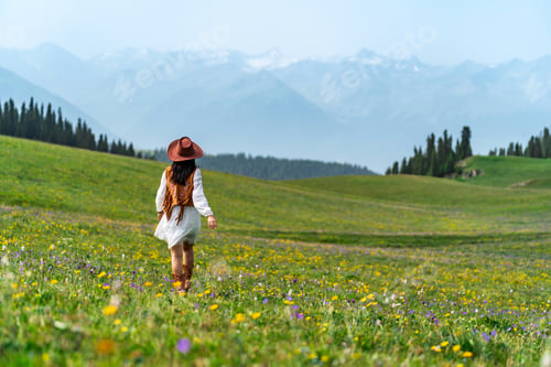 Preview: Young woman traveler relaxing and enjoying beautiful Scenery landscape with colorful flowers