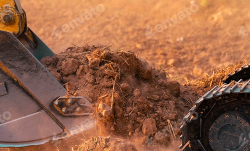 Preview: Metal bucket of backhoe digging soil. Excavator working at construction site. Earth moving machine.