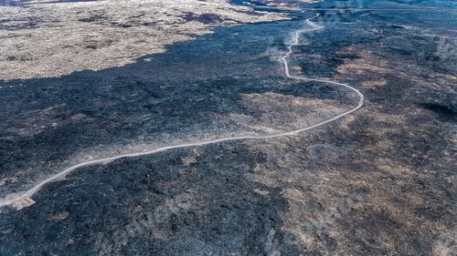 Preview: Road going through bare volcanic landscape
