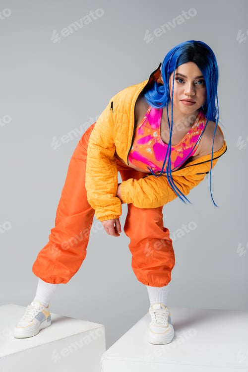 Preview: vibrant clothes, dyed hair, female model with blue hair posing