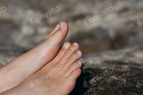 Preview: Close-up female dirty bare feet.