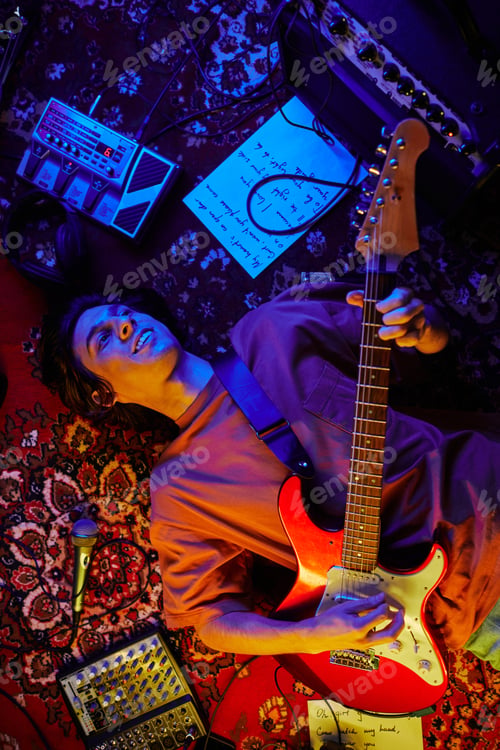 Preview: Guitarist Lying on Carpet in Neon