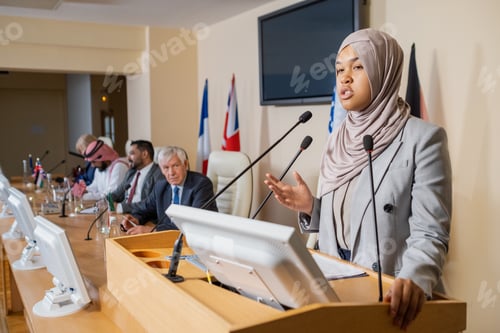 Preview: Muslim Politician Speaking Into Microphone