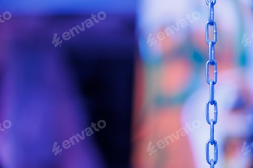 Preview: Chains hanging out of walls in illuminated rusty place