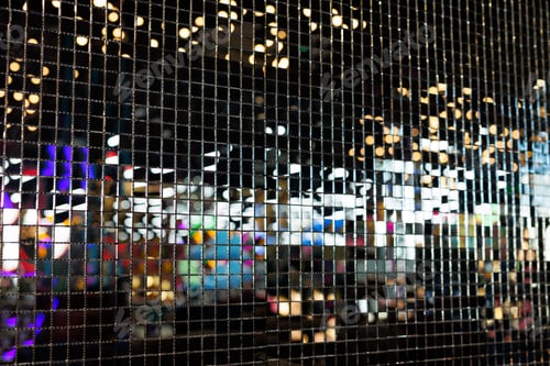 Preview: Decorative wall made of black shiny mosaics or sequins.