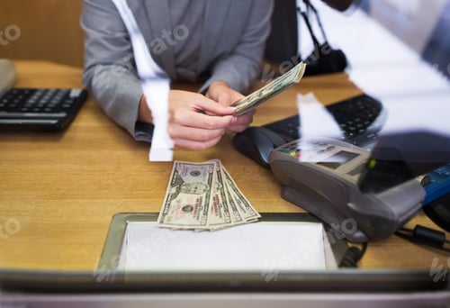 Preview: clerk giving cash money to customer at bank office
