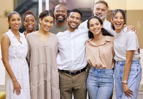 Preview: Portrait of a group of businesspeople casually posing for a photo in a modern office