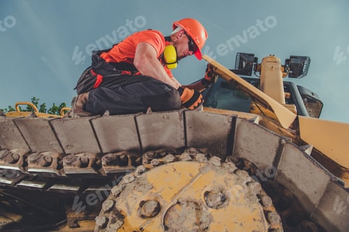 Preview: Bulldozer Operator Checking the Track