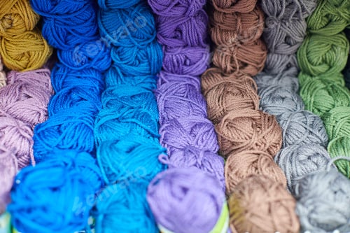 Preview: Yarns or balls of wool on shelves in store for knitting