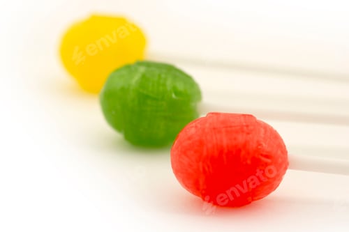 Preview: Three delicious lollipops isolated on white.
