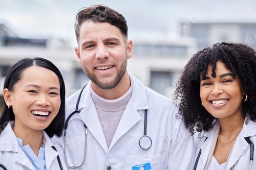 Preview: Team, smile and portrait of doctors for healthcare, medical service and working in the city. Teamwo