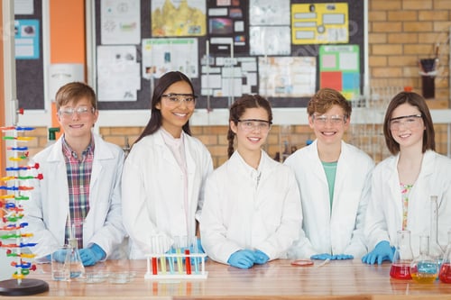 Preview: Portrait of school kids doing a chemical experiment in laboratory