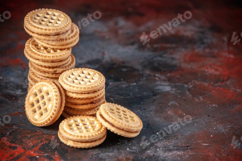 Preview: Top view of delicious cookies arranged in different forms on the right side on mix colors background