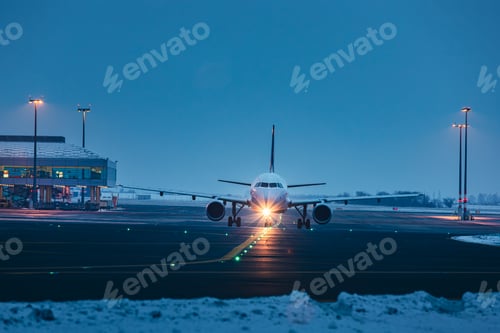 Preview: Front view of passenger airplane at airport
