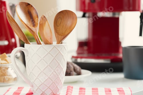 Preview: Kitchen utensils in cup on table close up