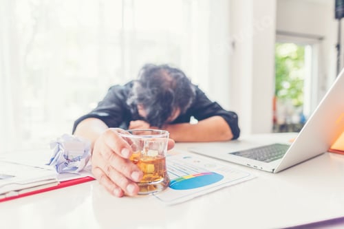 Preview: alcohol addiction - drunk businessman holding a glass of whiskey