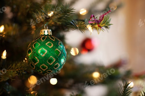 Preview: Close up of shiny green and red Christmas tree decorations,