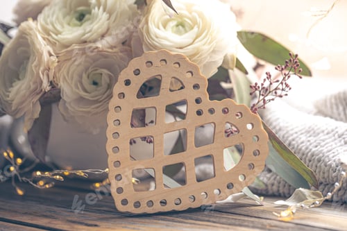 Preview: Close-up, decorative wooden heart and ranunculus flowers.