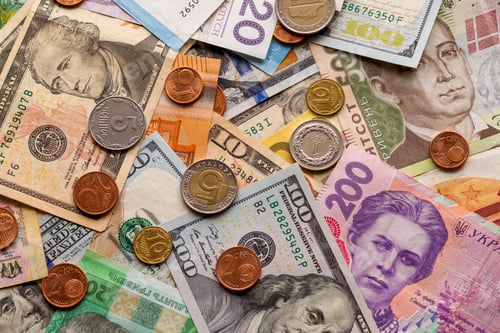 Preview: Colorful abstract background made of different metal coins, American, Ukrainian bills and euro