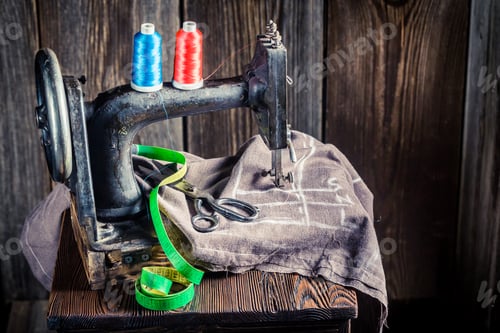 Preview: Old sewing machine with scissors and threads