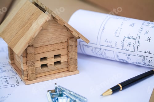 Preview: Building house on blueprints with worker - construction project