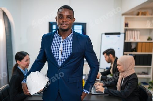 Preview: Successful businessman working and looking camera.