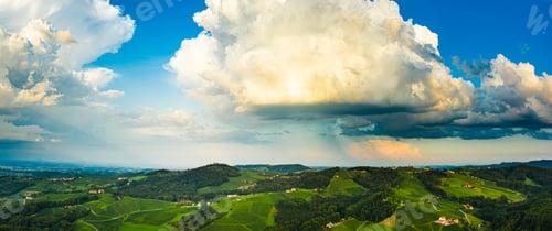 Preview: Gorgeous sunset over beautiful green vineyards. Aerial panorama sunset over Austrian grape hills in