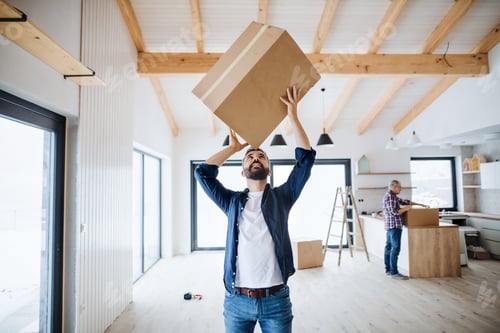 Preview: A mature man with his senior father furnishing new house, a new home concept.