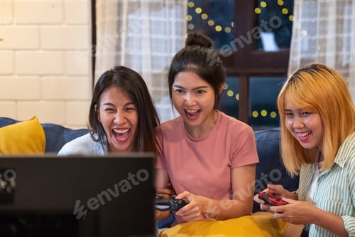 Preview: Excited Women Playing Video Games At Home