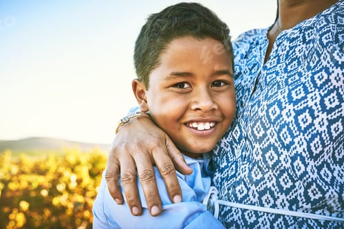 Preview: Moms arms are the most comforting and cozy. Portrait of a little boy hugging his mother outdoors.