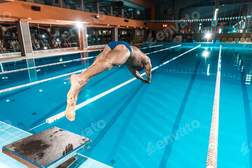 Preview: swimmer diving into competition swimming pool
