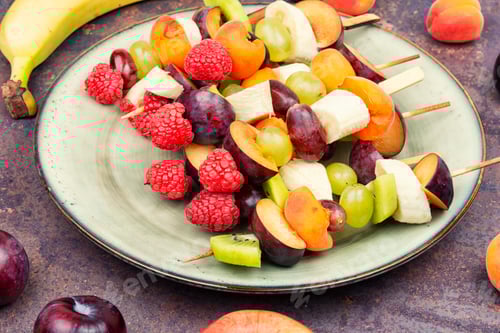 Preview: Delicious Fruit Skewers on a Light Green Plate