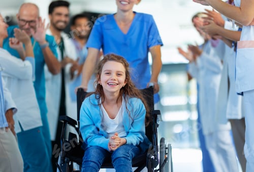 Preview: Medical staff clapping to little girl patient who recovered from serious illness.