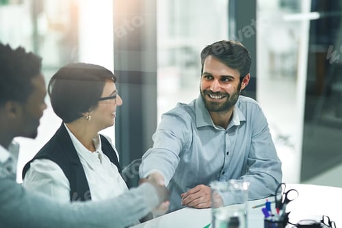 Preview: Cropped shot of businesspeople shaking hands during a meeting in a modern office