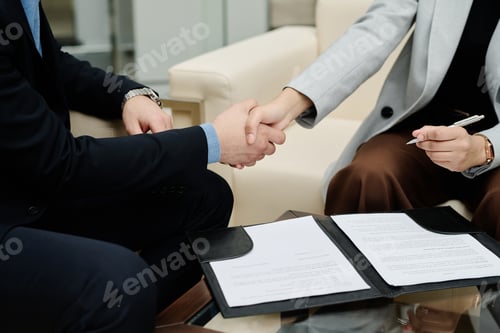 Preview: Business people concluding a deal at meeting