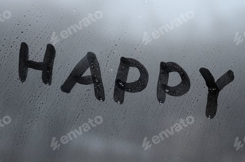 Preview: The English word "Happy" is written with a finger on the surface of the misted glass