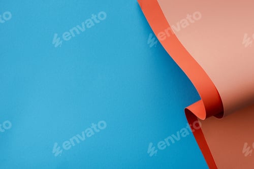 Preview: orange colorful paper swirl on blue background