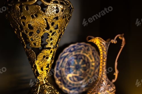 Preview: Old copper jug from the east on a black background