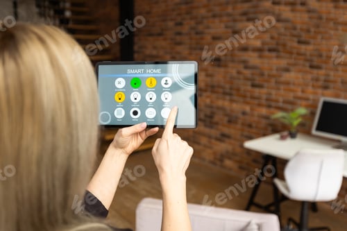 Preview: Iot Smart Home Concept - rear view of woman ask digital tablet to set temperature of air conditioner