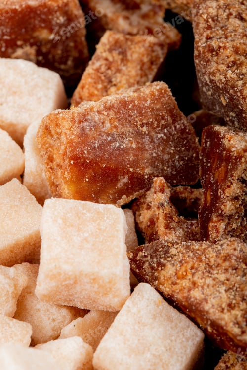 Preview: background of palm and brown sugar pieces side view