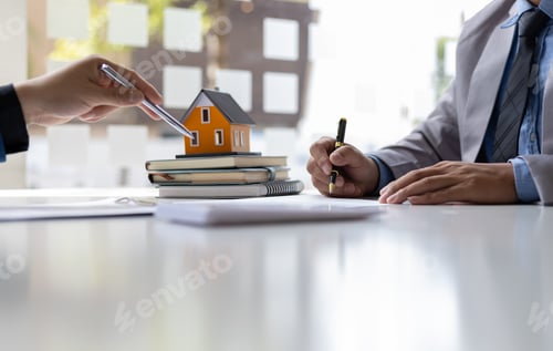 Preview: Real estate agent is discussing and explaining the terms of the home purchase contract.
