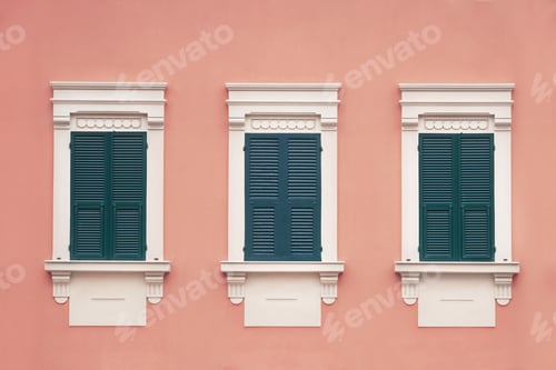Preview: three green wooden window with shutters in a white frame on pink wall