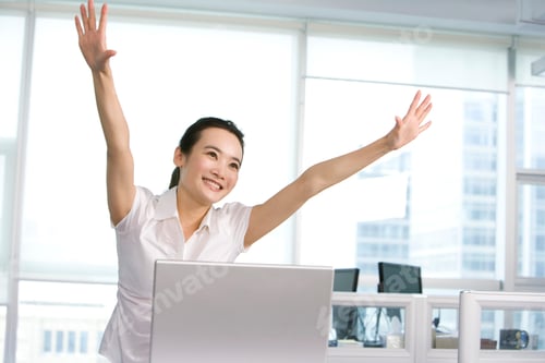 Preview: Happy office worker at her desk